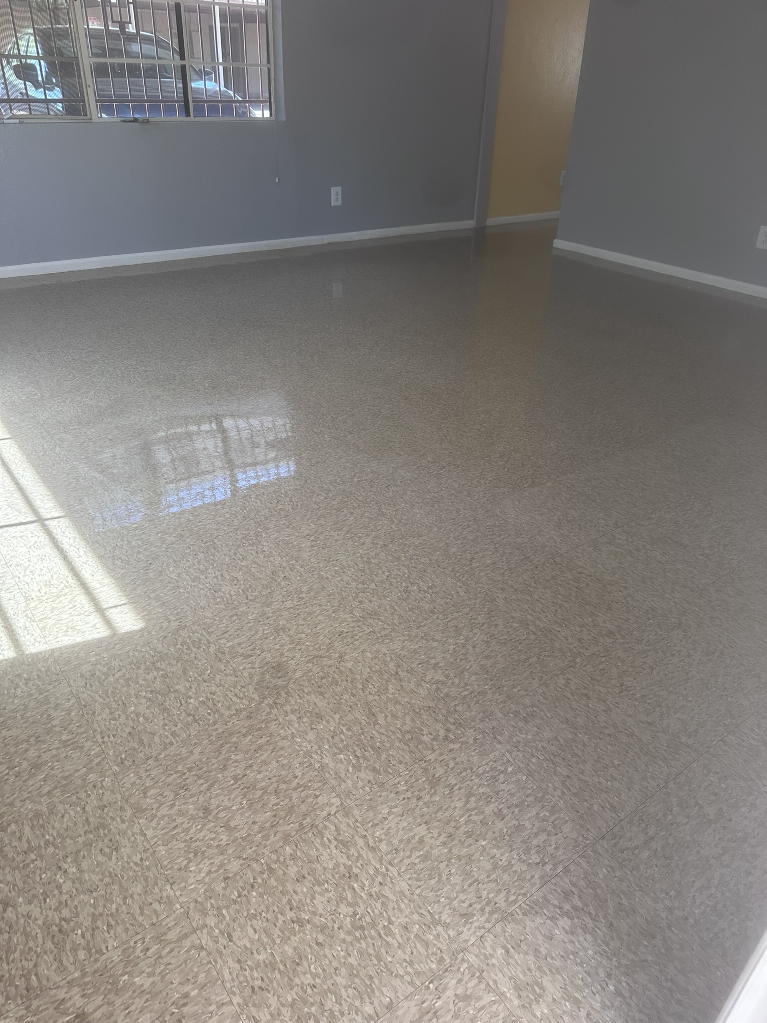 VCT strip and wax floor restoration completed for a rental turnover in Phoenix