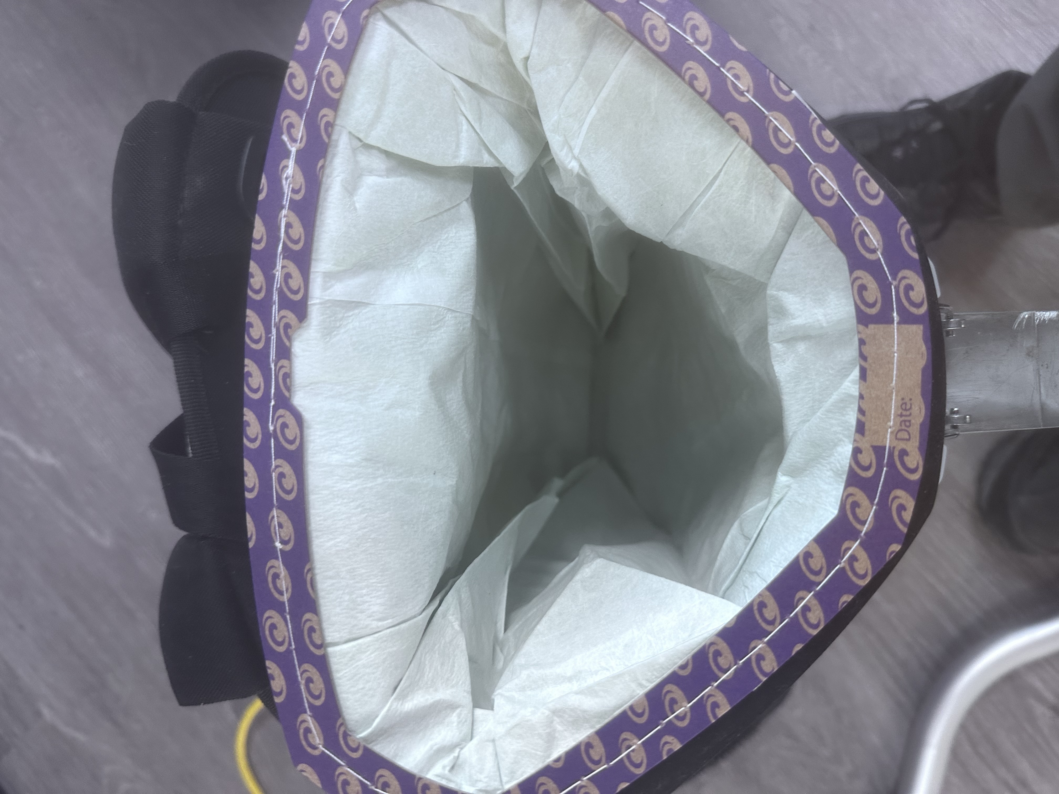 Clean HEPA vacuum dust bag installed after office cleaning